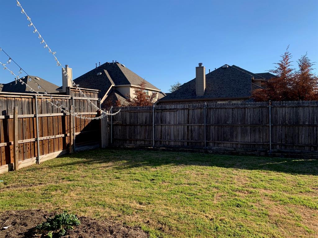 1017 Somerset Circle Forney, TX 75126 - Photo 11 of 21 a view of a backyard with a small cabin