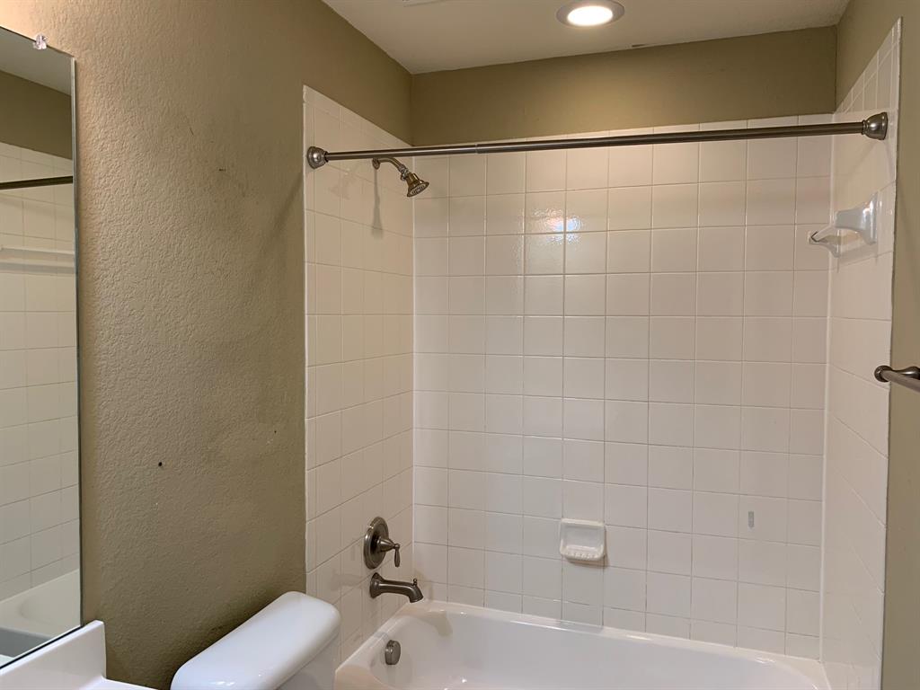 1017 Somerset Circle Forney, TX 75126 - Photo 17 of 21 a bathroom with a bathtub and a sink