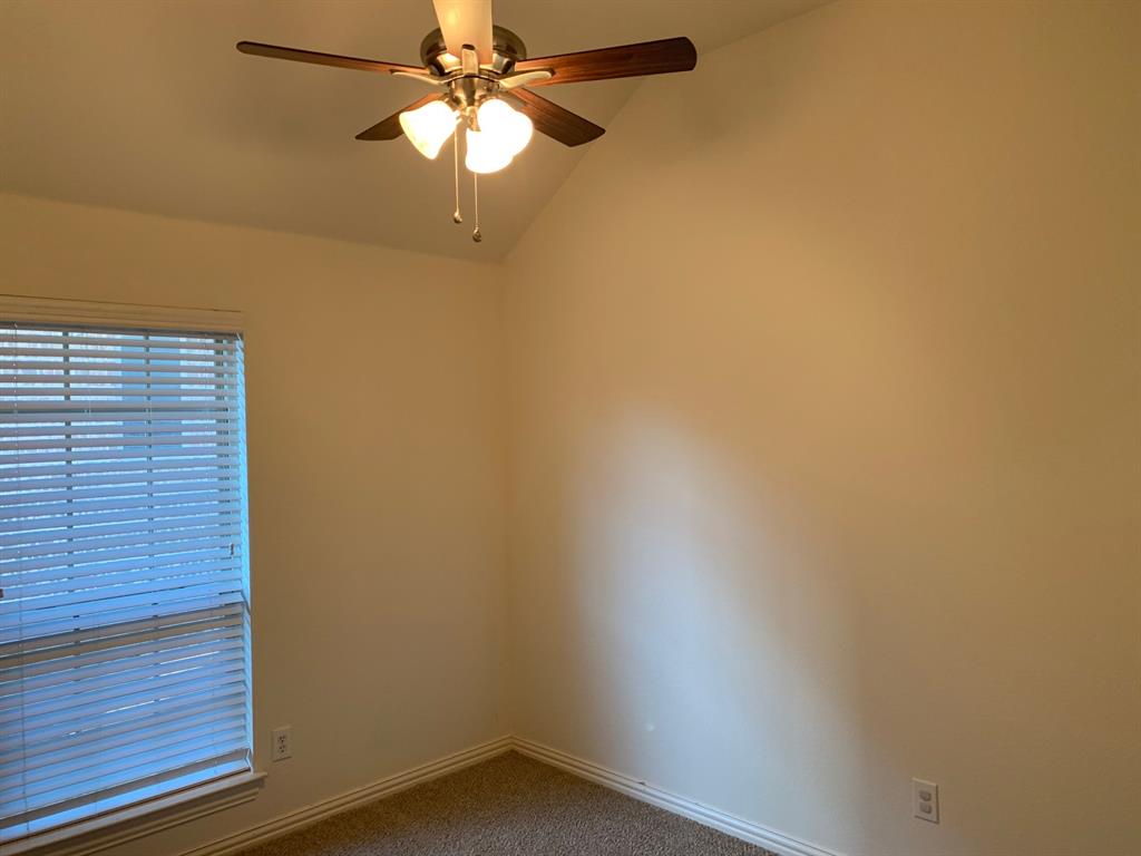 1017 Somerset Circle Forney, TX 75126 - Photo 19 of 21 a view of a small space with wooden floor and a ceiling fan