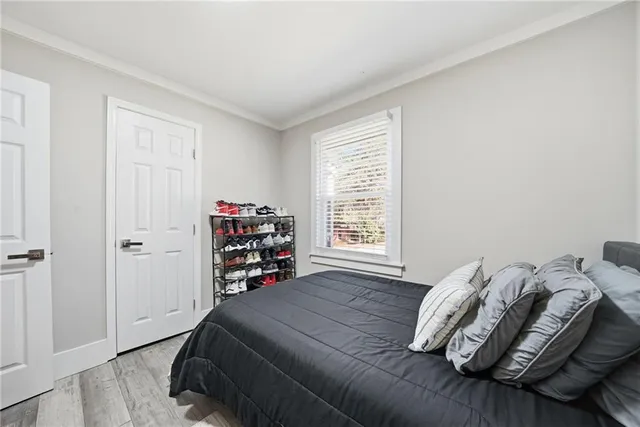 a bedroom with a bed and a tv