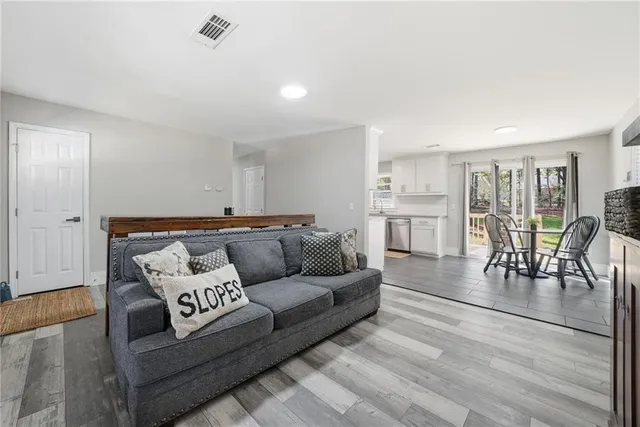 a living room with furniture and a table
