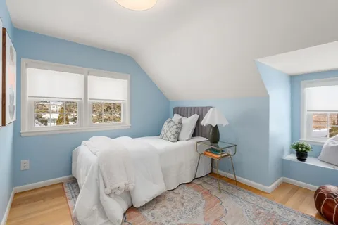 a bathroom with a granite countertop sink mirror and toilet