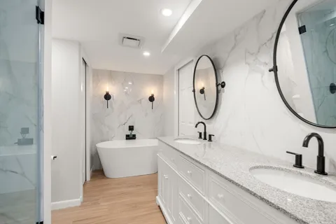 a view of a backyard with furniture and a fire pit