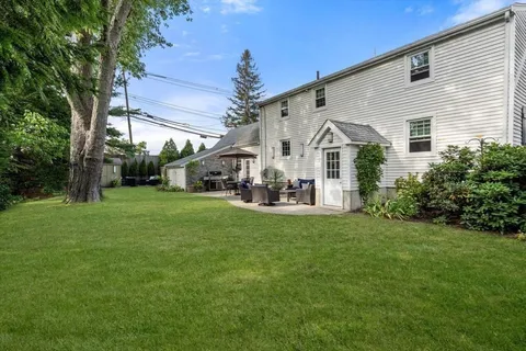 a aerial view of a house with backyard