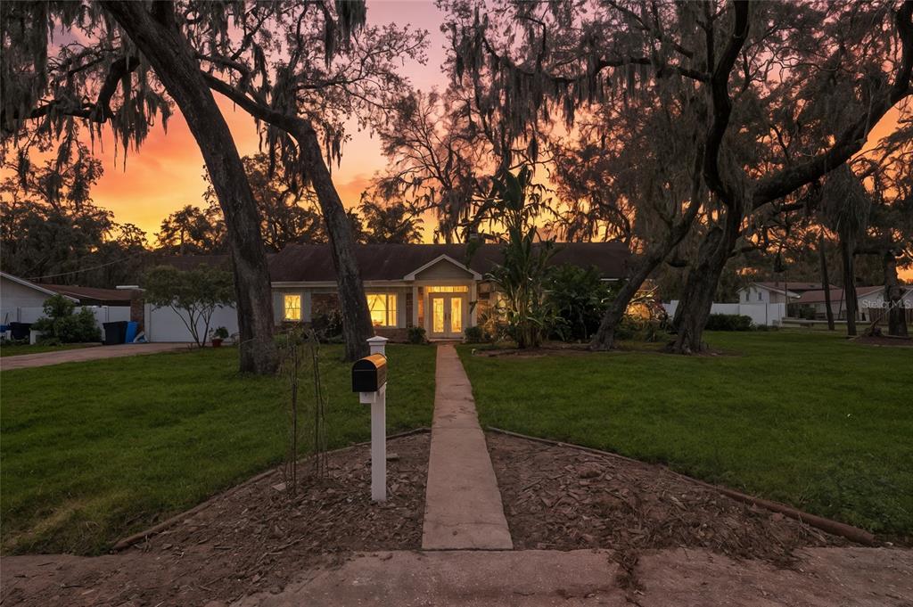 120 Windy Circle Brandon, FL 33511 - Photo 1 of 1 a front view of a house with a yard and trees