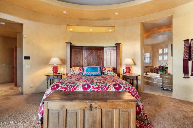 a bedroom with bed and a table