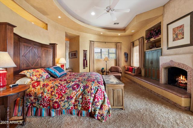 a bed room with a bed and a fireplace