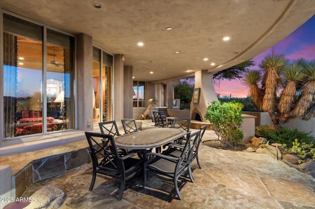 a view of a dining room with furniture and a potted plant