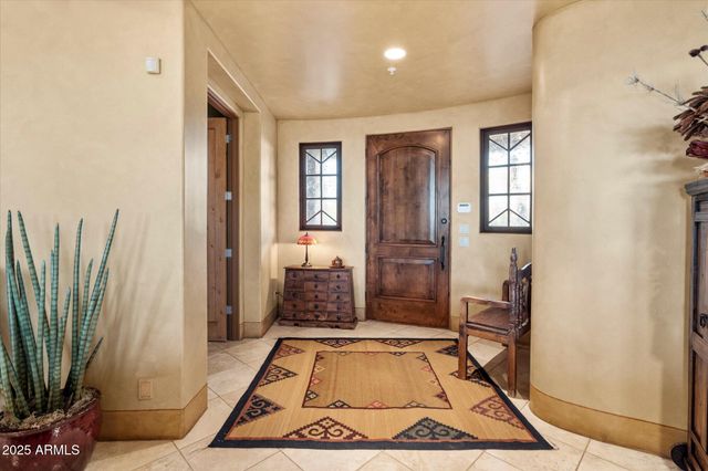 a living room with a rug floor and a rug