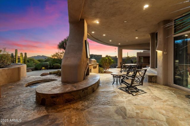 a view of a patio with table and chairs floor to ceiling window and a yard