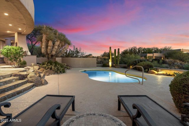 a view of a swimming pool with a lounge chairs