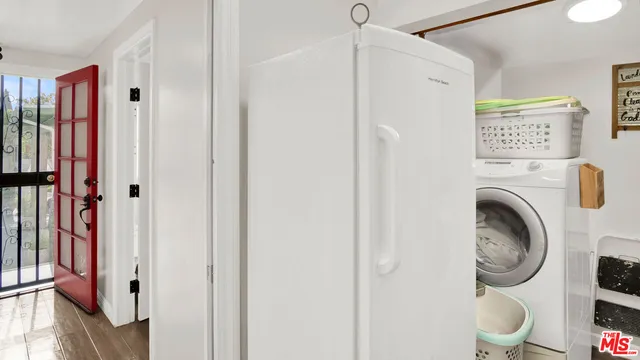 a kitchen with a sink a stove and a refrigerator