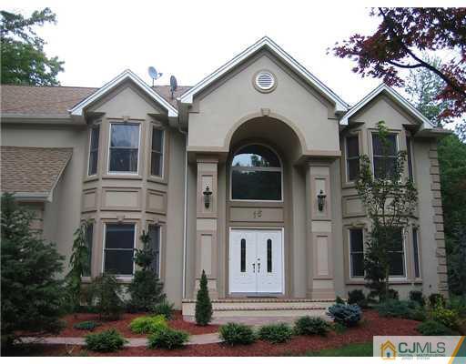 16 Parker Road, Unit NONE Edison, NJ 08820 - Photo 1 of 8 a front view of a house with a yard