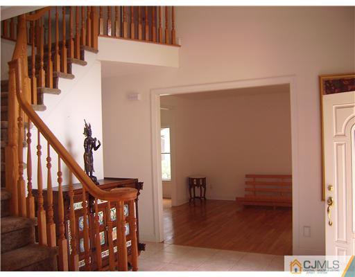 16 Parker Road, Unit NONE Edison, NJ 08820 - Photo 2 of 8 a view of entryway with wooden floor