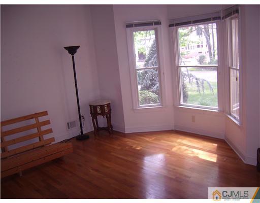 16 Parker Road, Unit NONE Edison, NJ 08820 - Photo 5 of 8 a view of an empty room with a window
