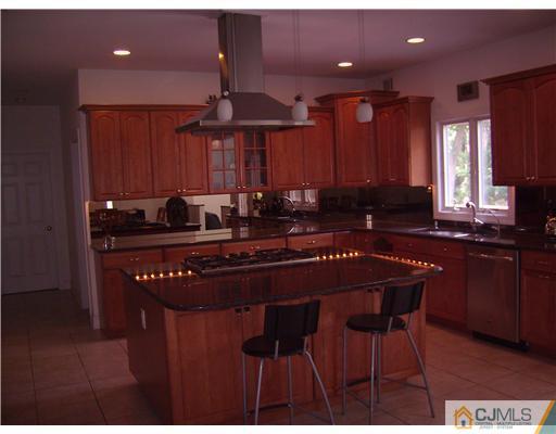 16 Parker Road, Unit NONE Edison, NJ 08820 - Photo 6 of 8 a kitchen with a sink cabinets and window