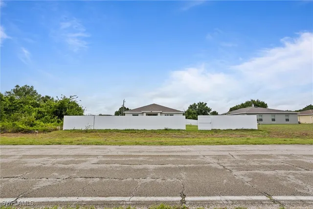 a view of a town with big trees