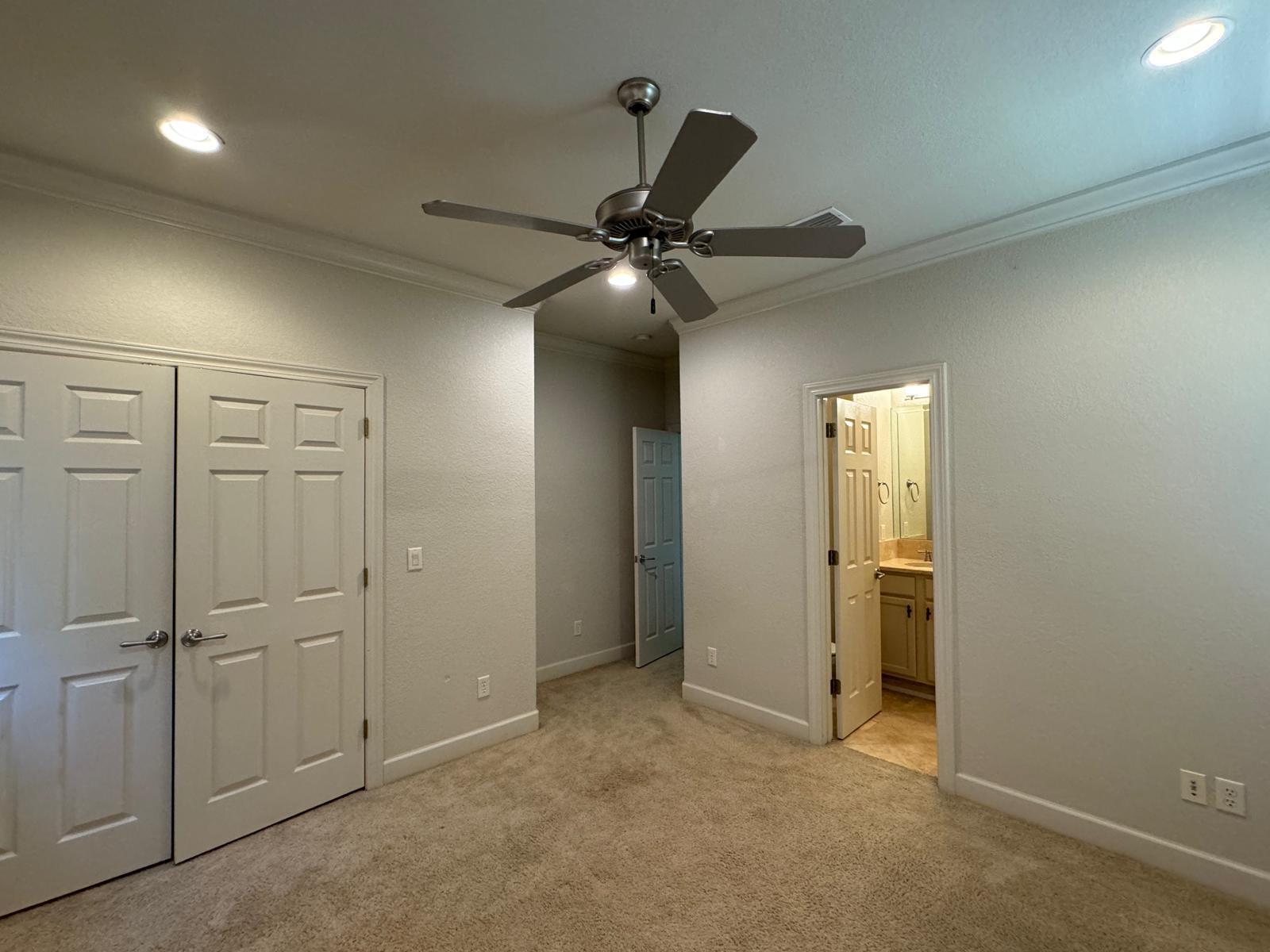 241 Inverrary Drive Destin, FL 32541 - Photo 16 of 24 an empty room with closet and a ceiling fan