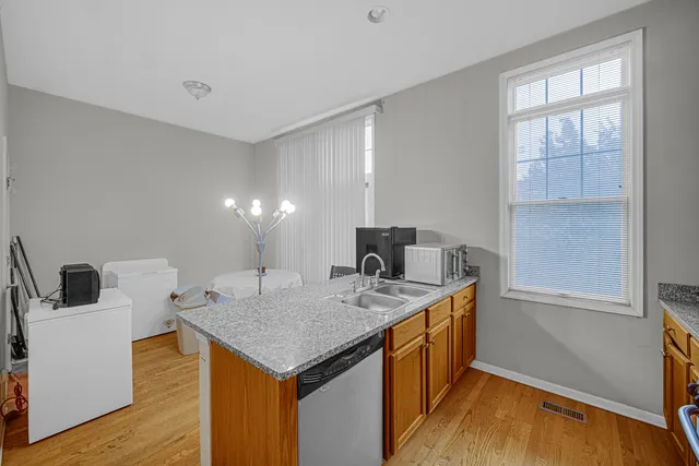 a kitchen that has a cabinets and a sink