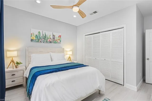 a bedroom with a bed and a walk in closet