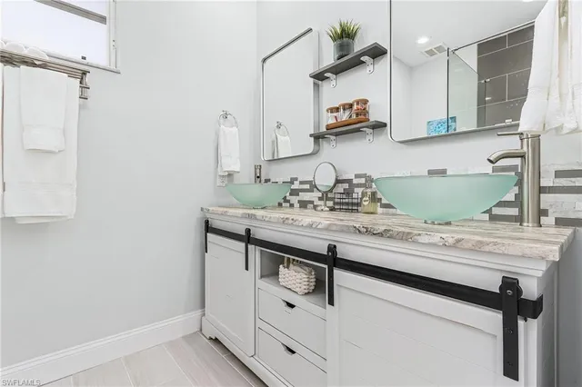 a bathroom with a sink and a mirror