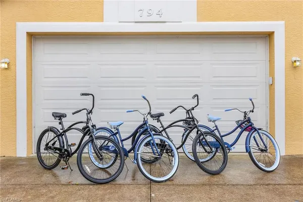 a couple of bicycles are next to a wall