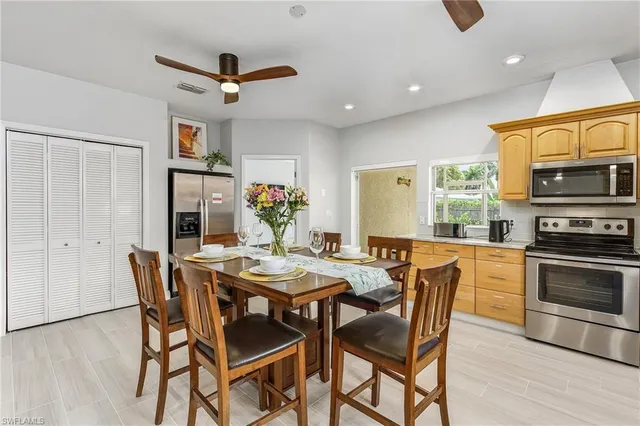 a dining room with furniture and window