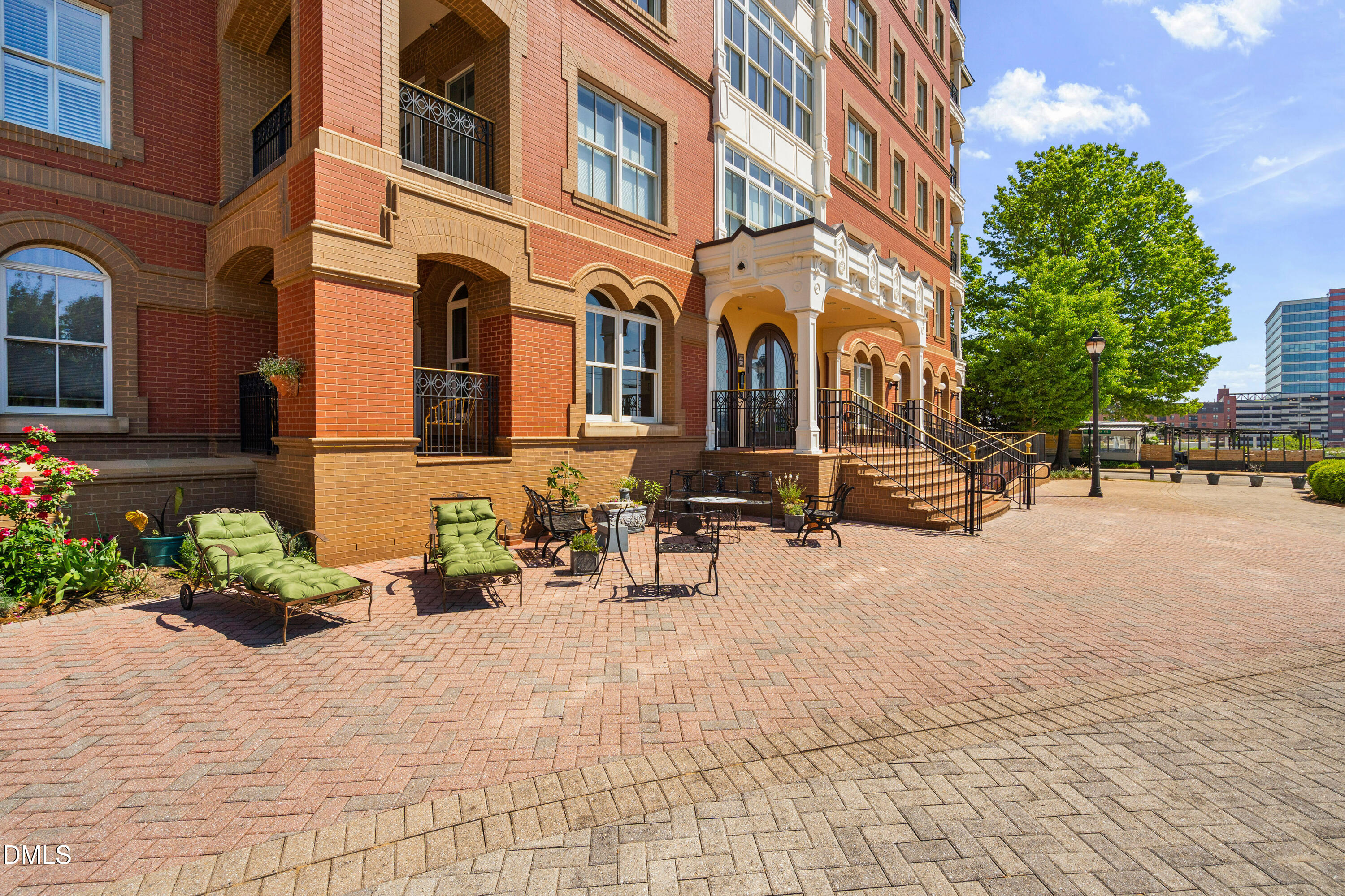 710 Independence Place, Unit 104 Raleigh, NC 27603 - Photo 2 of 34 a row of palm trees in front of a building
