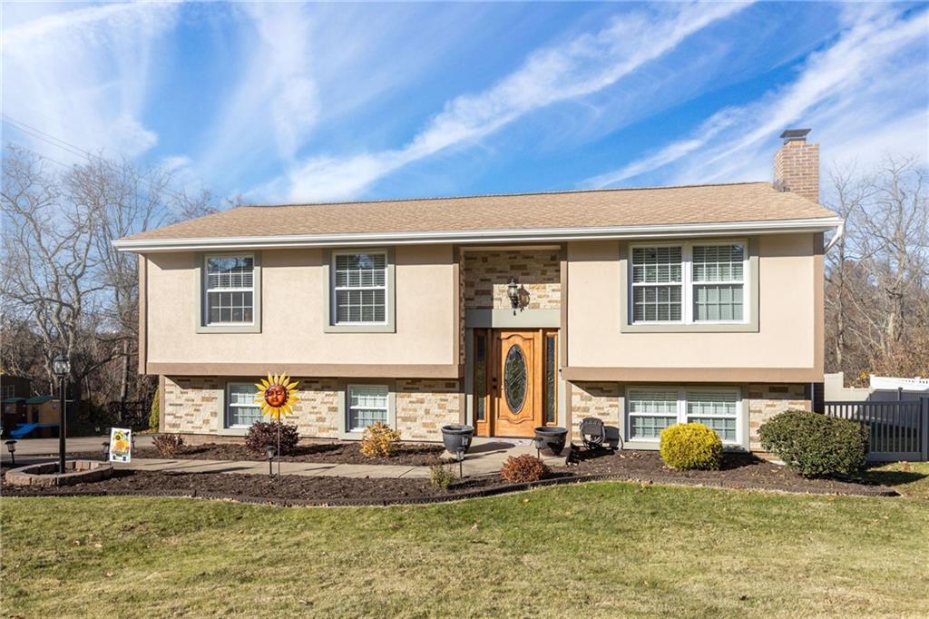 110 Tory Road Coraopolis, PA 15108 - Photo 2 of 19 a front view of a house with garden and trees