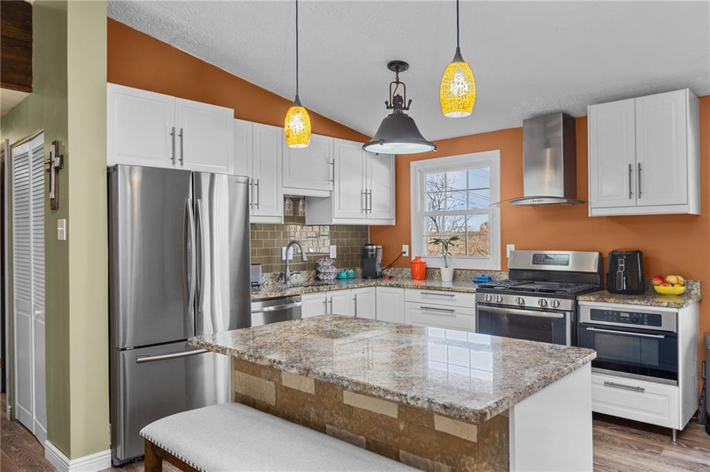 110 Tory Road Coraopolis, PA 15108 - Photo 5 of 19 a kitchen with stainless steel appliances granite countertop a refrigerator a stove and a sink