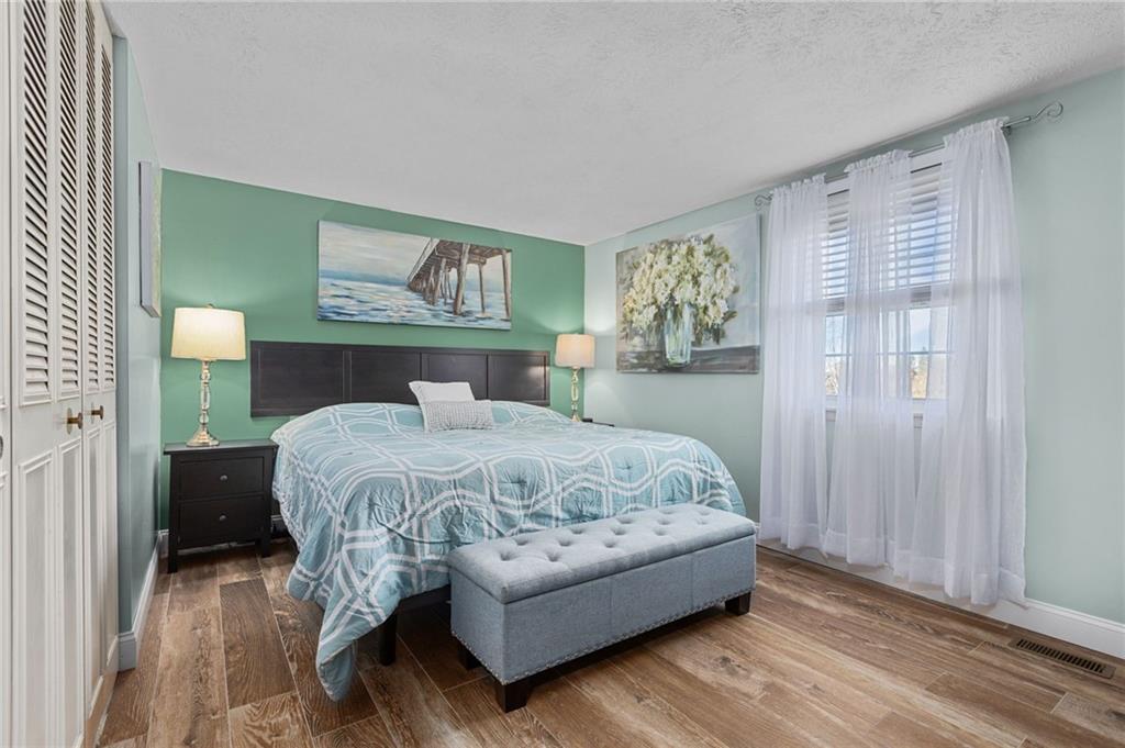 110 Tory Road Coraopolis, PA 15108 - Photo 8 of 19 a bedroom with a bed and a painting on the wall