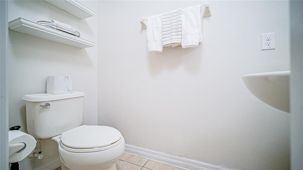 2528 Dharma Circle Kissimmee, FL 34746 - Photo 11 of 46 a bathroom with a toilet and a sink