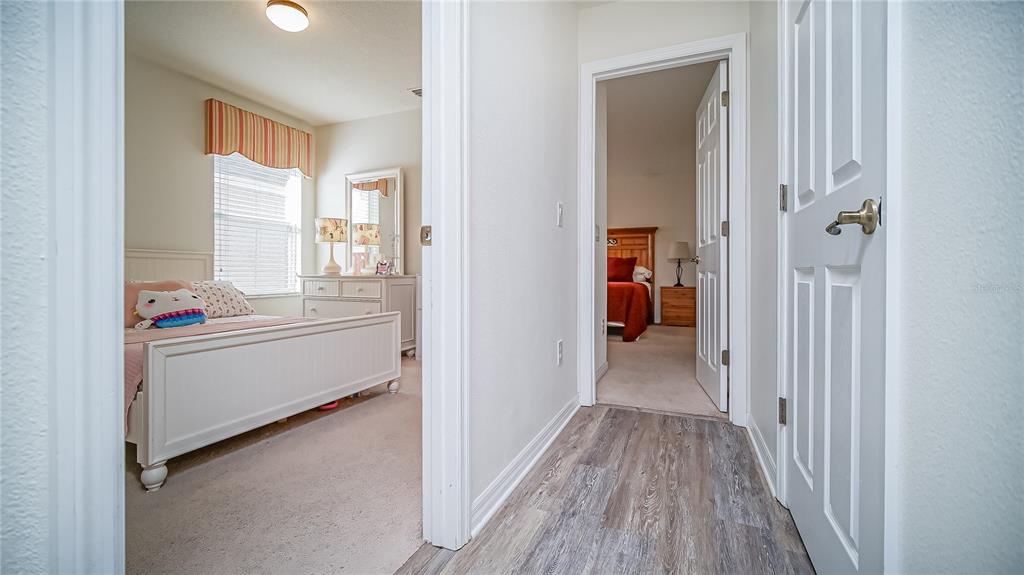 2528 Dharma Circle Kissimmee, FL 34746 - Photo 21 of 46 a view of hallway with wooden floor