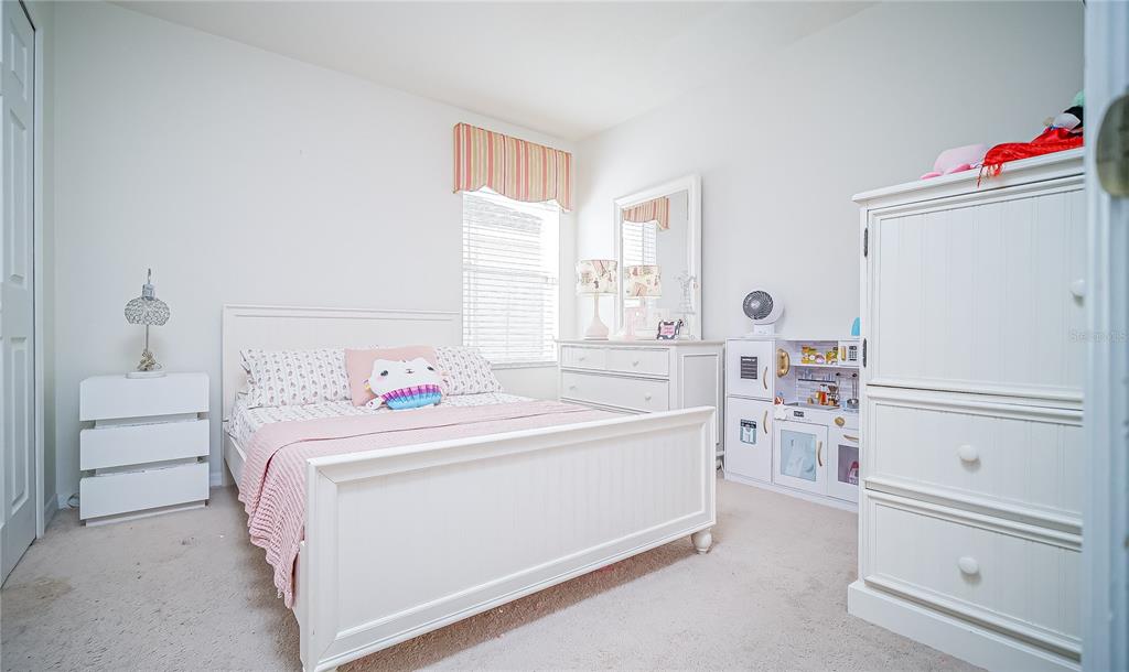 2528 Dharma Circle Kissimmee, FL 34746 - Photo 22 of 46 a room with a bed and a window