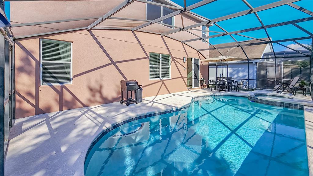 2528 Dharma Circle Kissimmee, FL 34746 - Photo 35 of 46 a view of outdoor kitchen and dining area