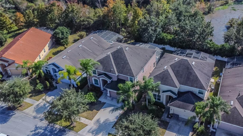 2528 Dharma Circle Kissimmee, FL 34746 - Photo 38 of 46 an aerial view of a house with plants and large trees