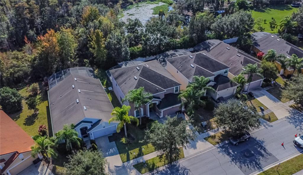 2528 Dharma Circle Kissimmee, FL 34746 - Photo 40 of 46 an aerial view of a house with plants and a yard