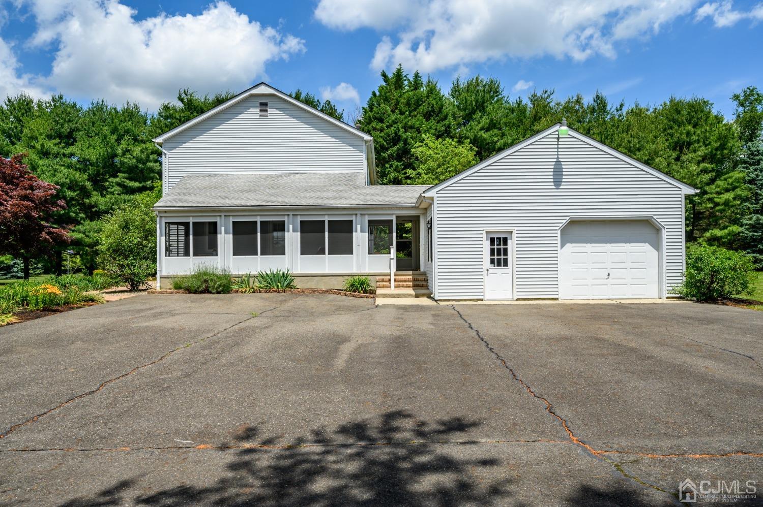 138 Georgetown Wrightstown Road Wrightstown, NJ 08562 - Photo 50 of 60 a front view of a house with a yard and garage