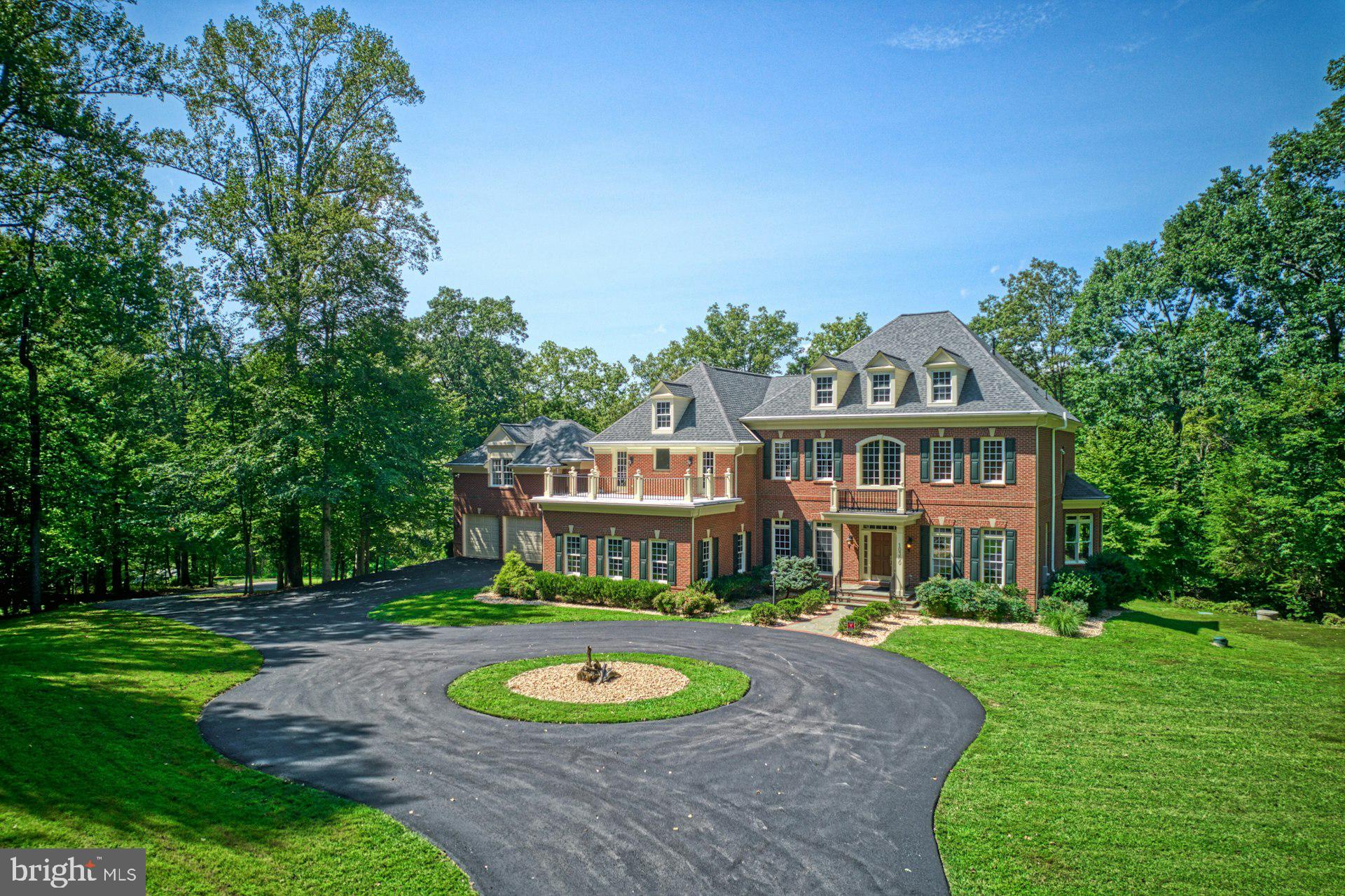 a view of a big yard with a house in the background
