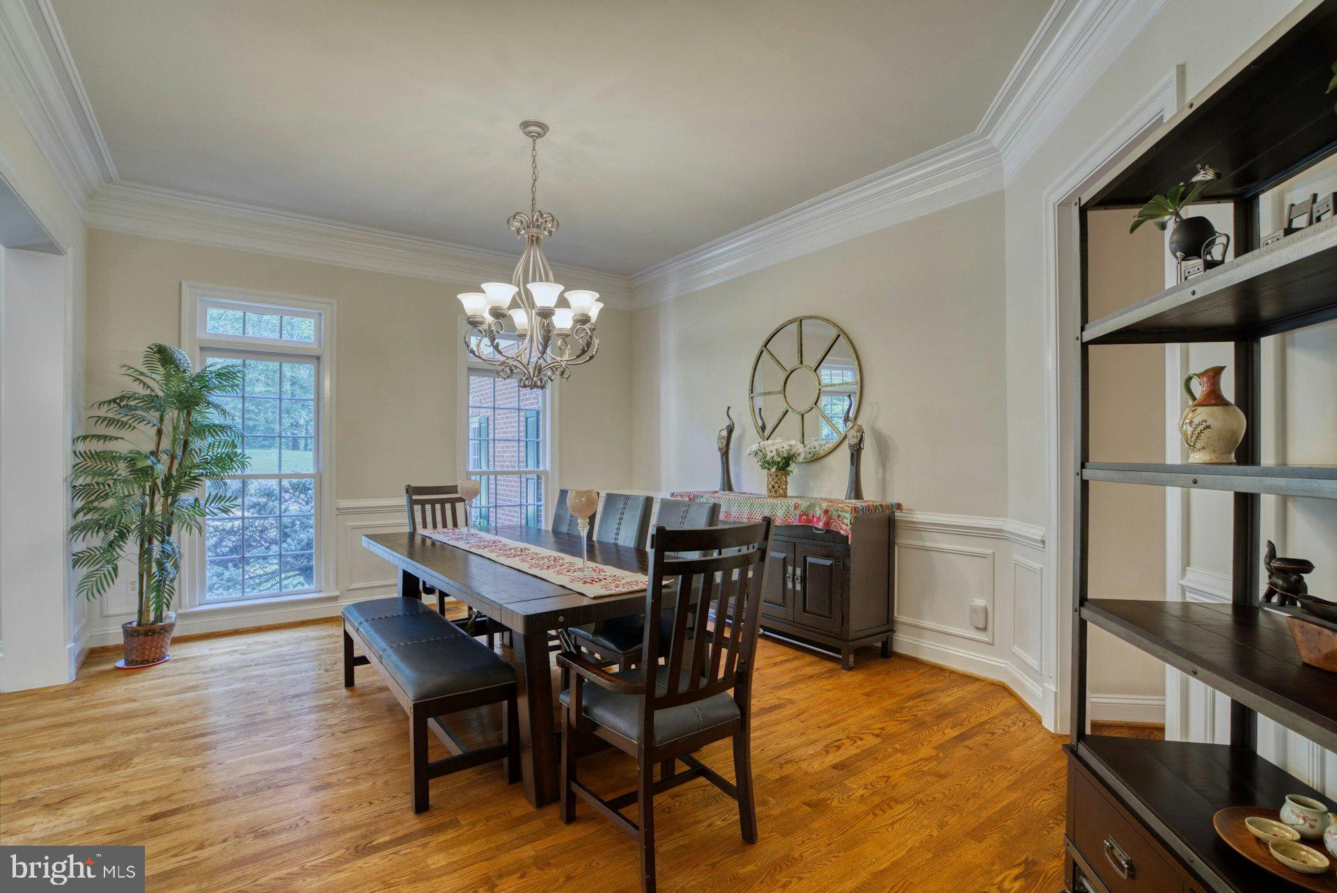 10300 Hampton Road Fairfax Station, VA 22039 - Photo 15 of 89 a view of a dining room with furniture window and wooden floor