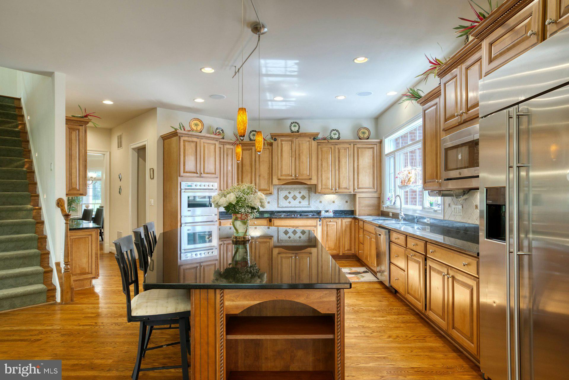 10300 Hampton Road Fairfax Station, VA 22039 - Photo 18 of 89 a kitchen with counter top space appliances and cabinets