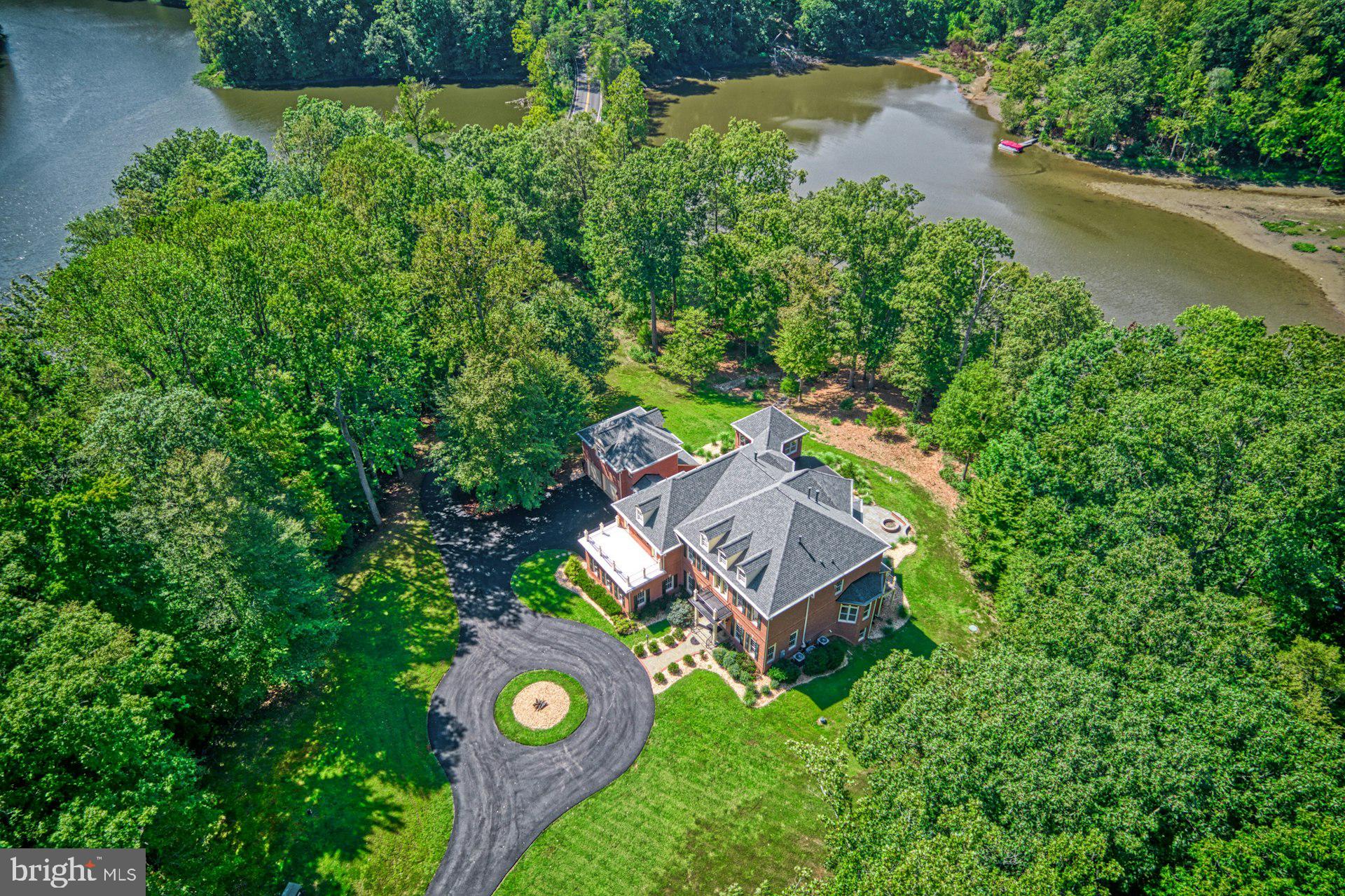 10300 Hampton Road Fairfax Station, VA 22039 - Photo 2 of 89 an aerial view of a house with a yard