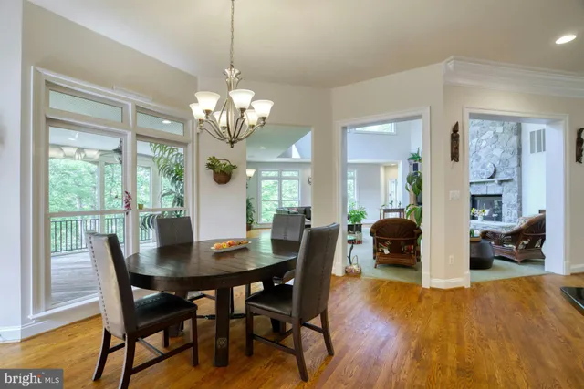 a view of a room with balcony and wooden floor