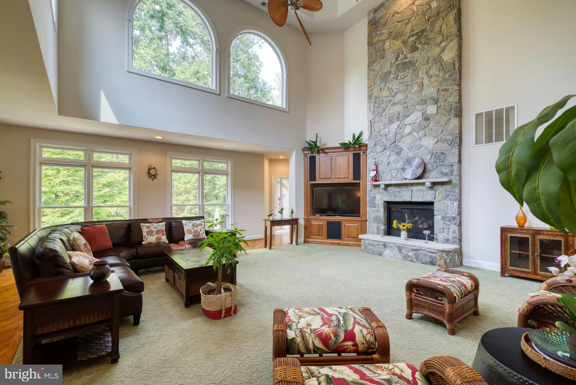 10300 Hampton Road Fairfax Station, VA 22039 - Photo 27 of 89 a living room with furniture fireplace and a large window