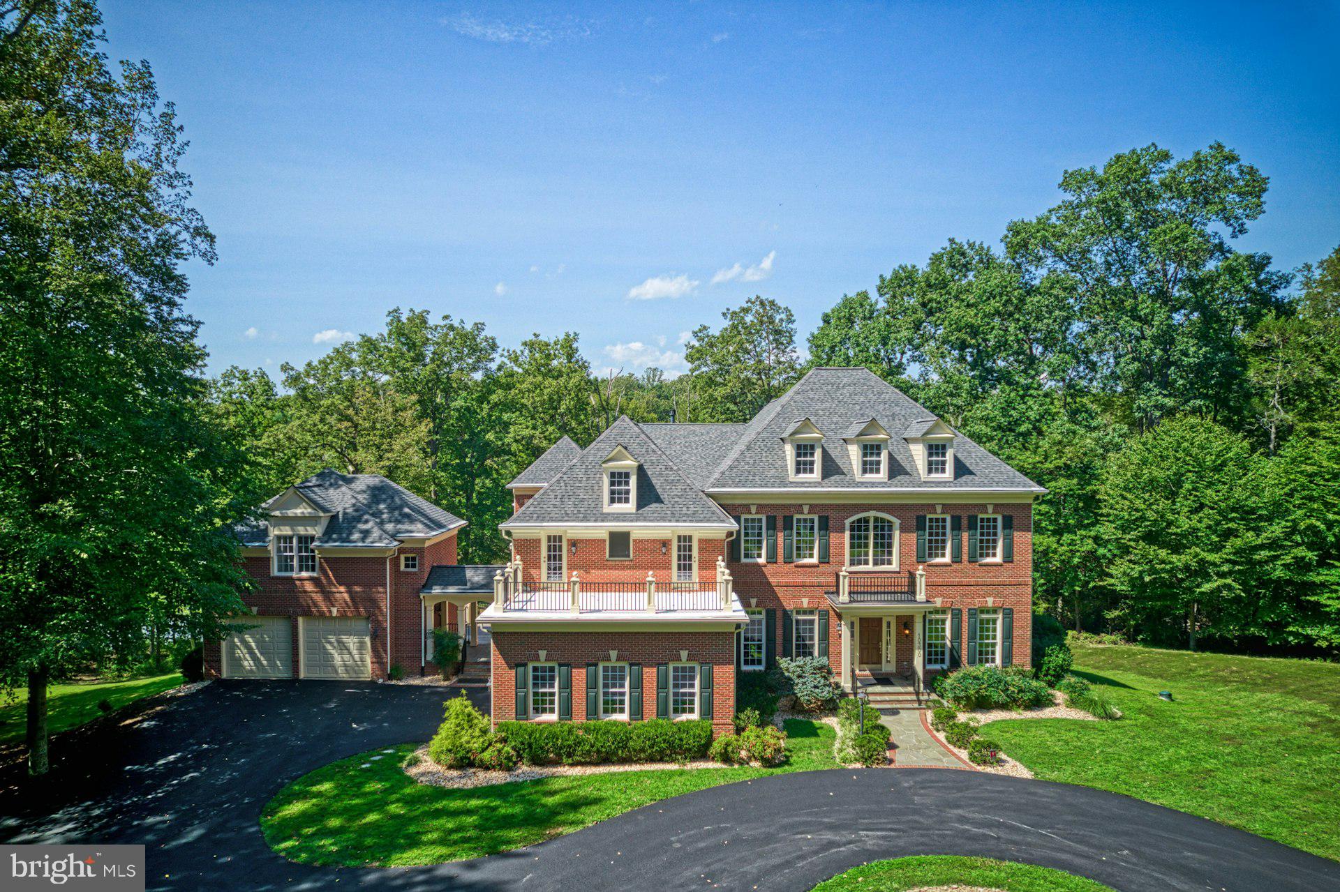 10300 Hampton Road Fairfax Station, VA 22039 - Photo 3 of 89 a front view of a house with garden