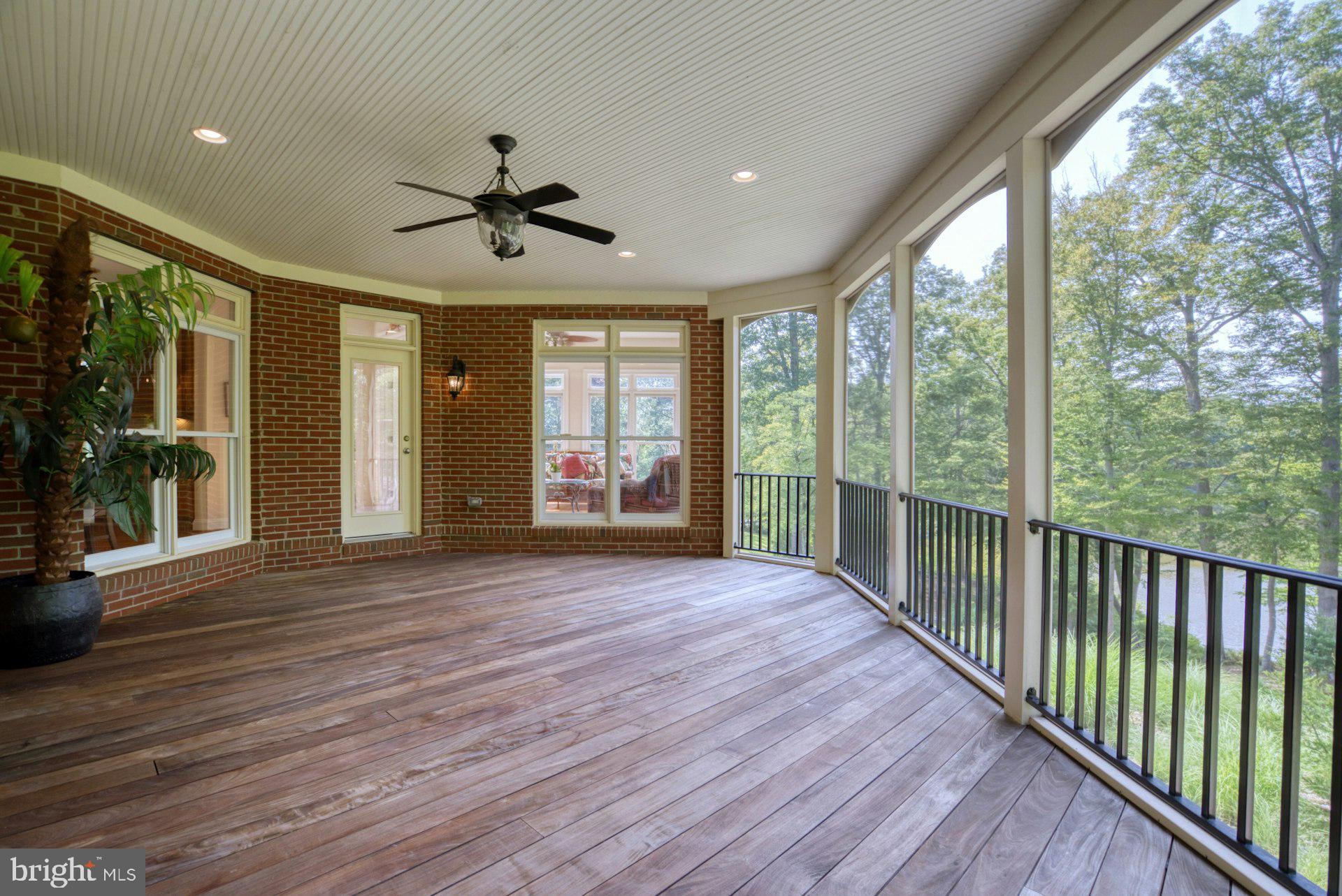 10300 Hampton Road Fairfax Station, VA 22039 - Photo 33 of 89 a view of a porch with wooden floor and windows