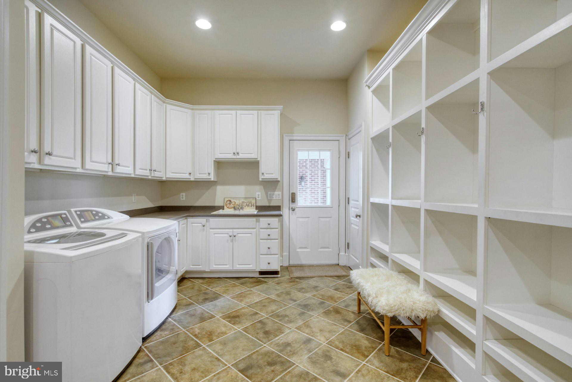 10300 Hampton Road Fairfax Station, VA 22039 - Photo 35 of 89 a kitchen with a stove a sink and a refrigerator