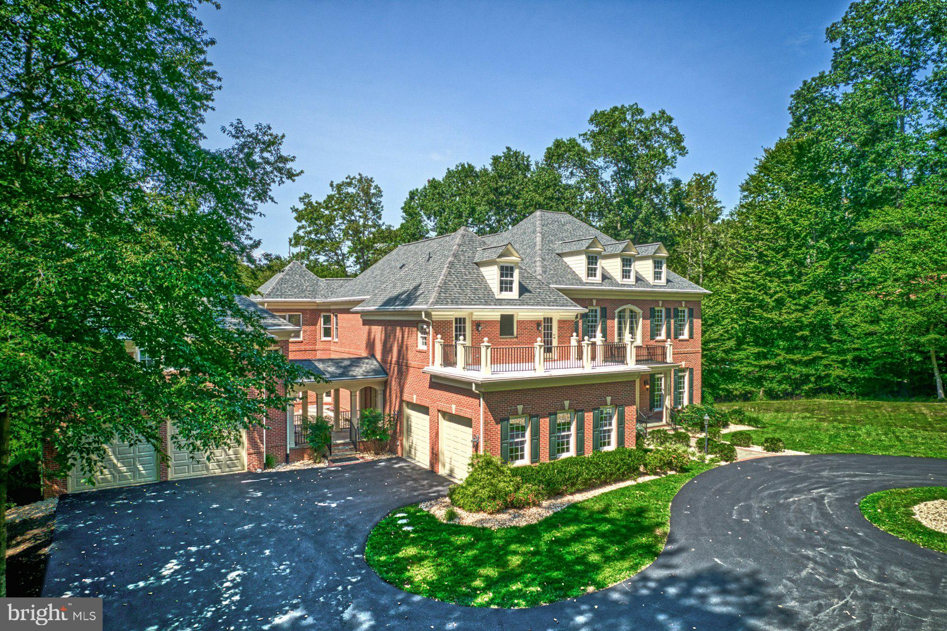 10300 Hampton Road Fairfax Station, VA 22039 - Photo 4 of 89 a front view of a house with a garden