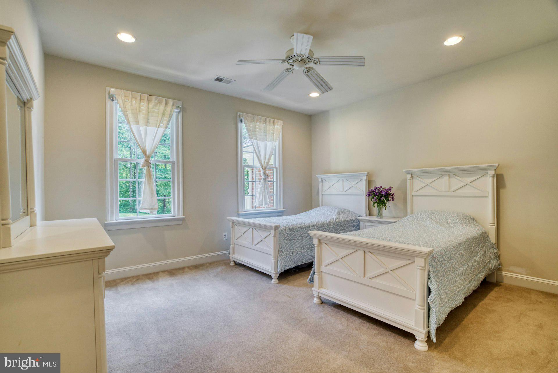 10300 Hampton Road Fairfax Station, VA 22039 - Photo 47 of 89 a spacious bedroom with a bed and a window
