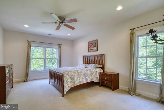 an aerial view of a house with a yard and garden in the back
